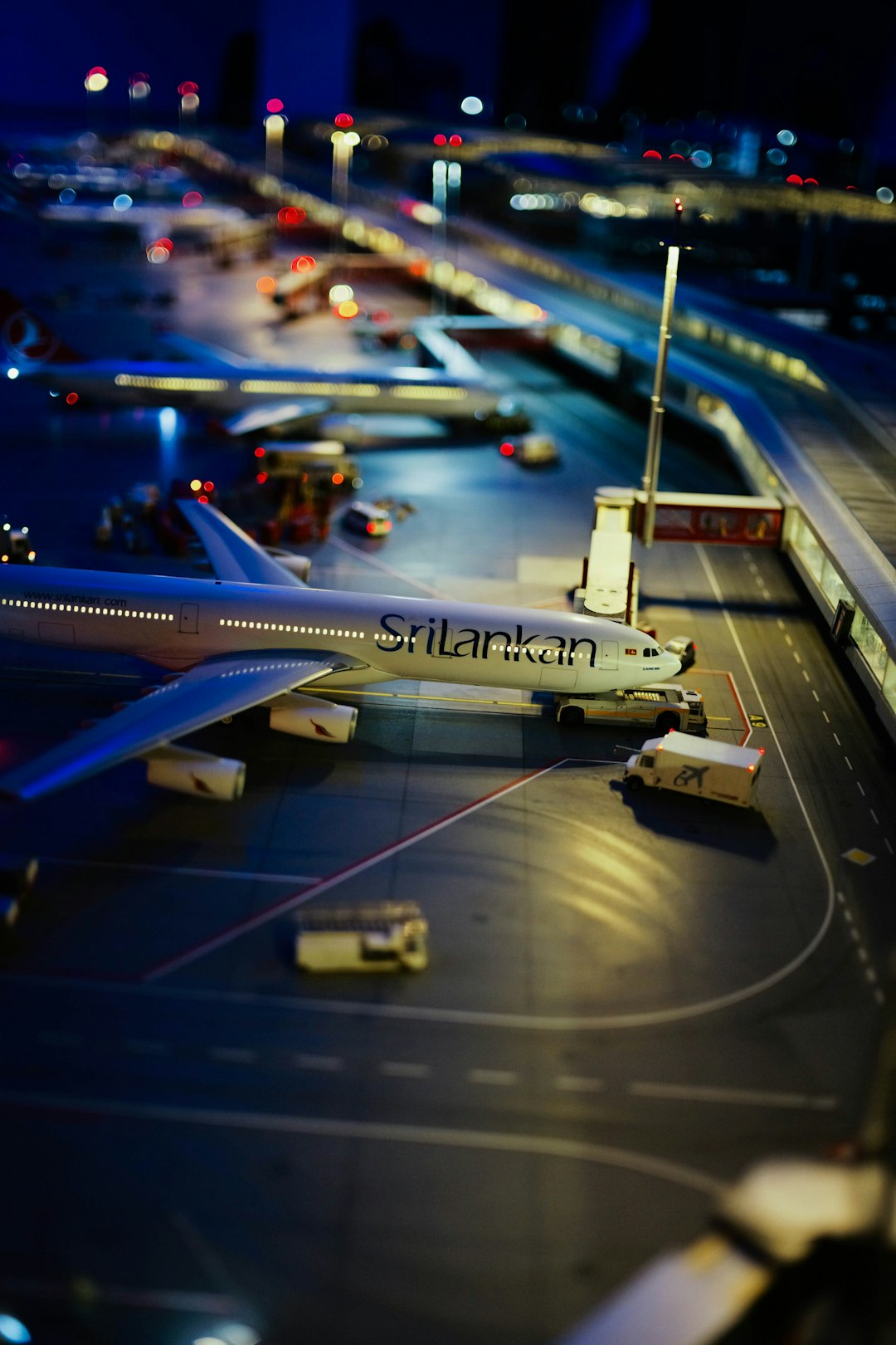 a-model-of-an-airplane-on-a-runway-r7anv-uslvg